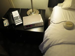 A bed shaker ensures that guests with a hearing disability are awakened when a fire alarm goes off.