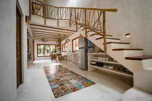 Interior of one of the rustic chic villas at Zorba Beach Homes in Tulum